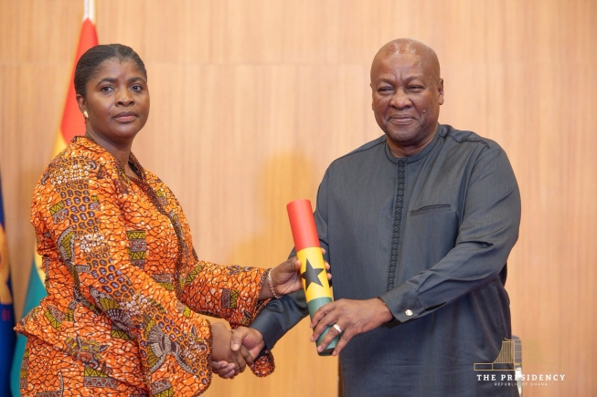 Deputy EC Chair, Afi Agbenyoh being sworn into office by President Mahama
