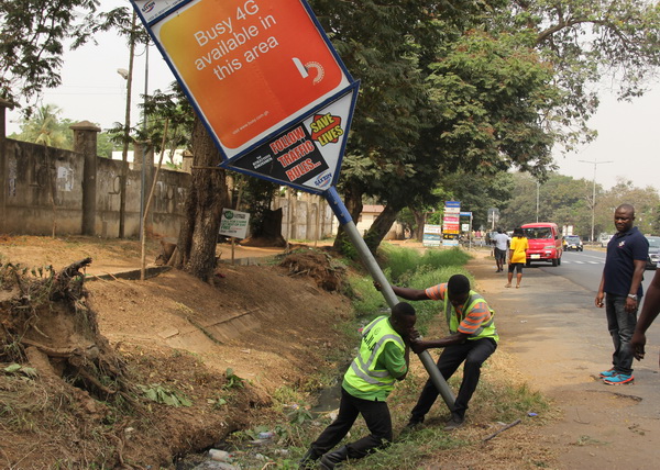 Unauthorized signpost being removed